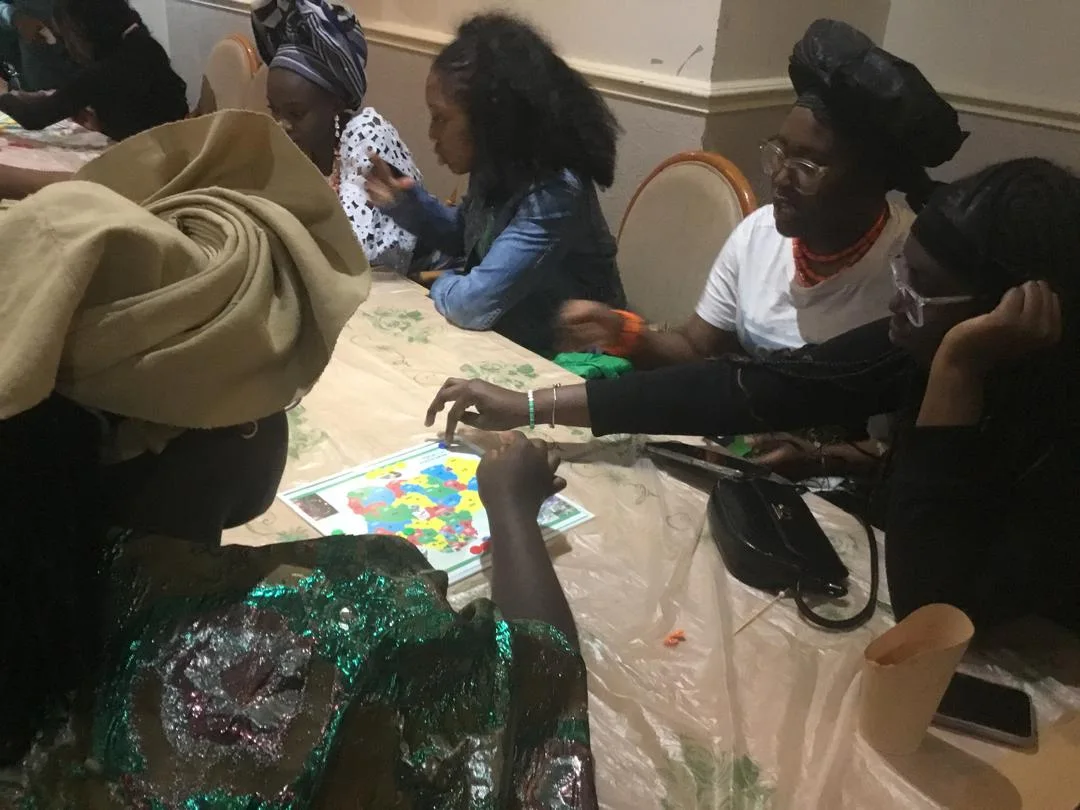 Youths playing Build Naija Ludo in Liverpool.